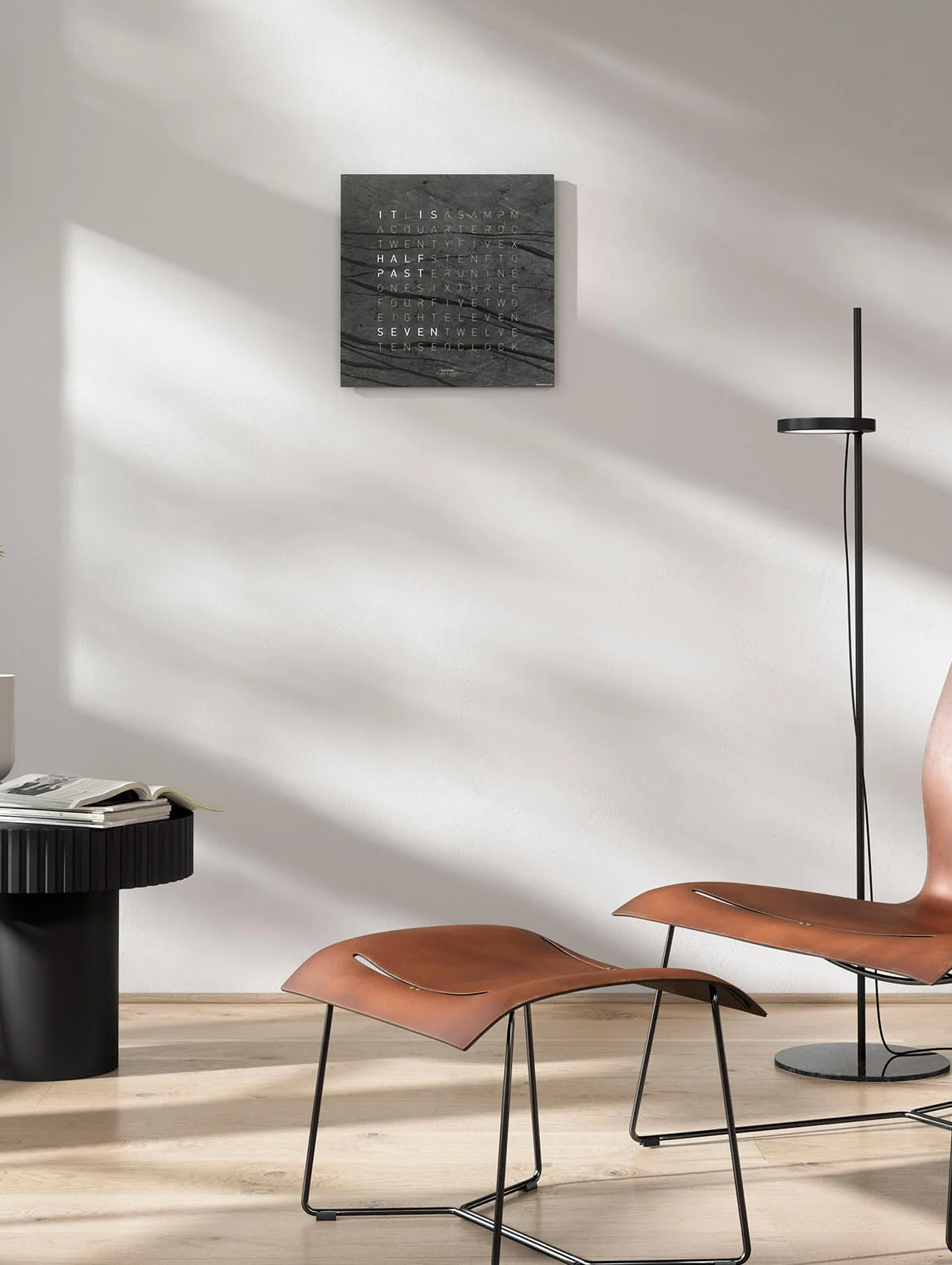 QLOCKTWO EARTH 45 Creator's Edition Metamorphite word clock with natural slate stone surface in an elegant interior