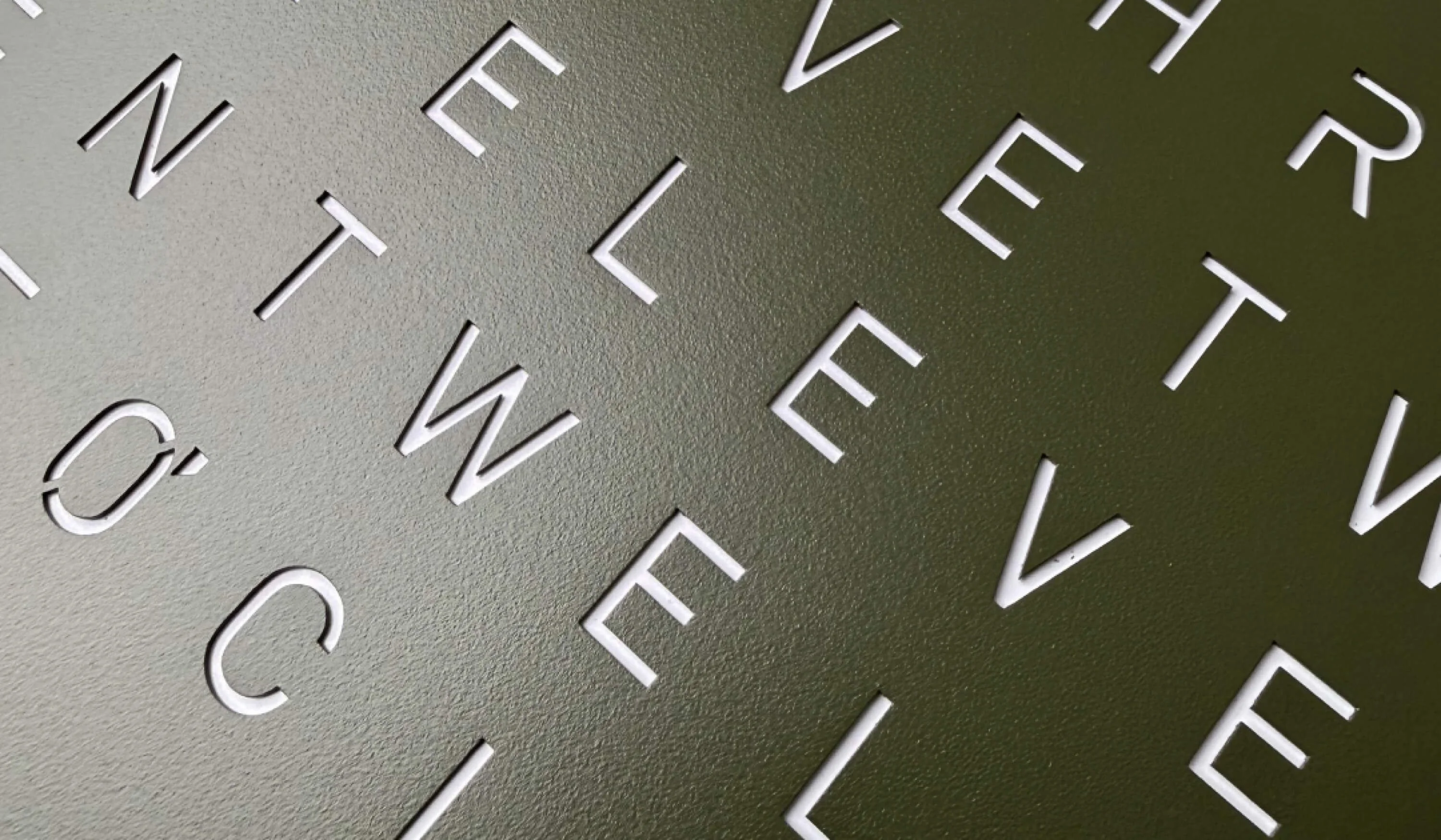 Detailshot Frontcover Olive, QLOCKTWO, time in words, letters, green, olive