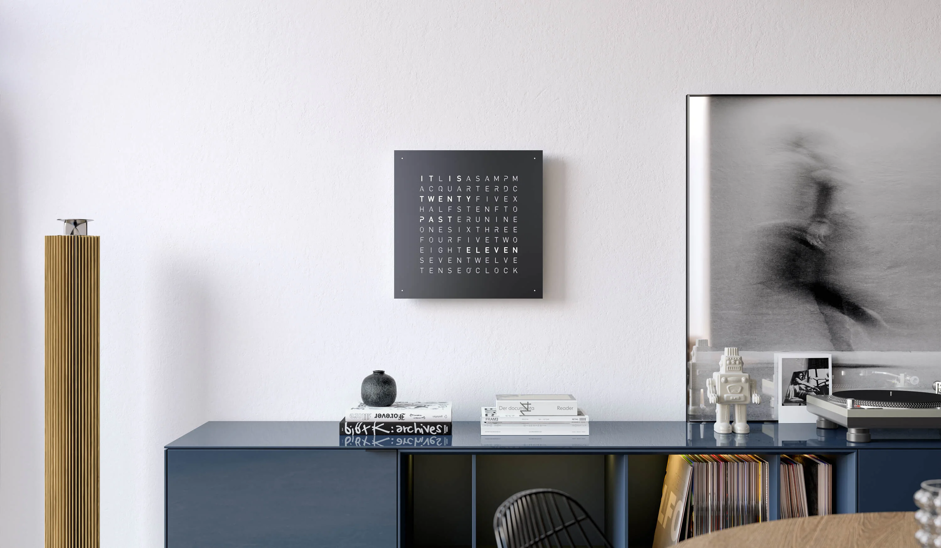 QLOCKTWO EARTH 45 Black Pepper word clock with black finish displayed in a modern living room